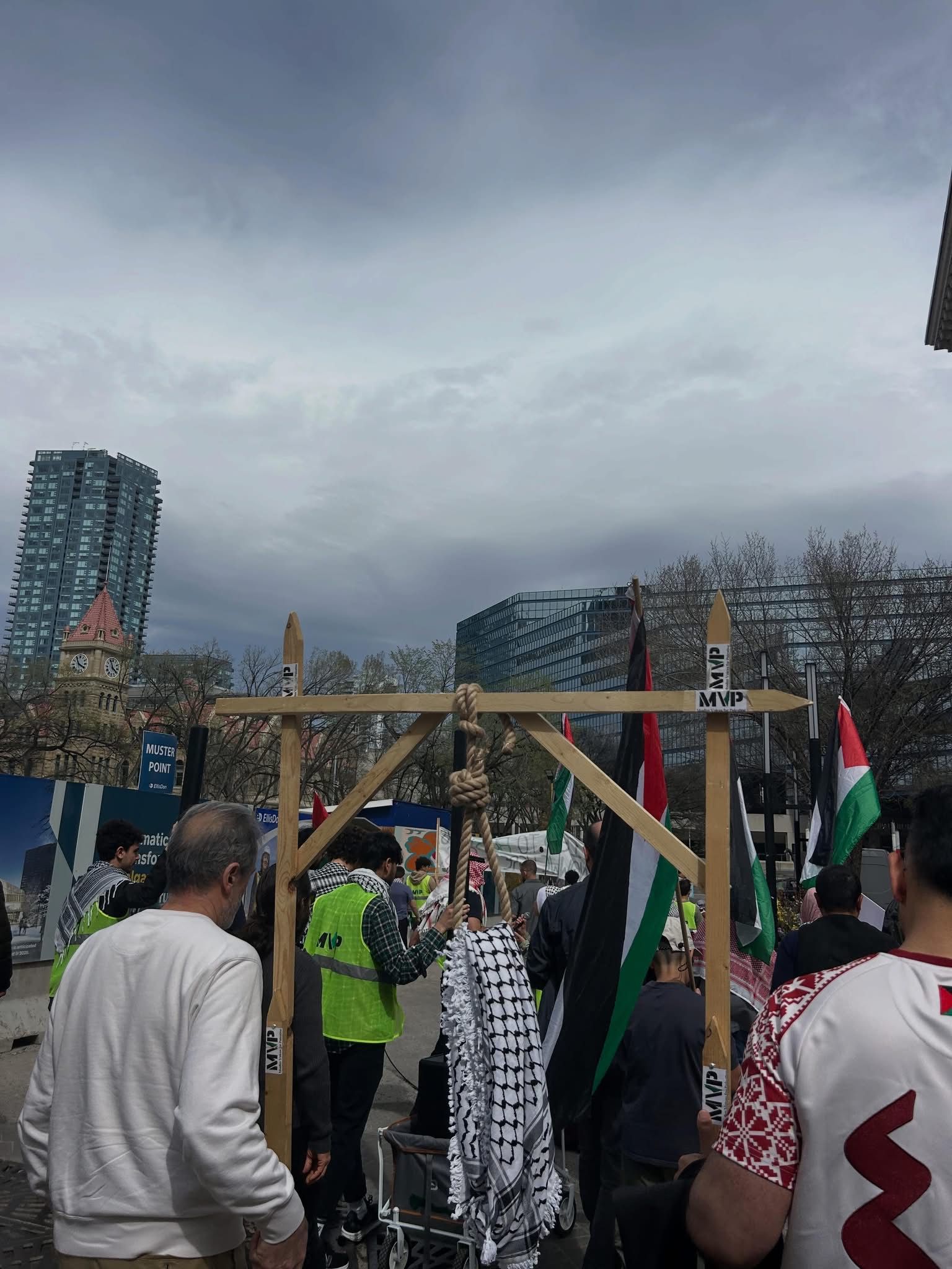 A symbolic protest installation with MVP signs at the downtown muster point